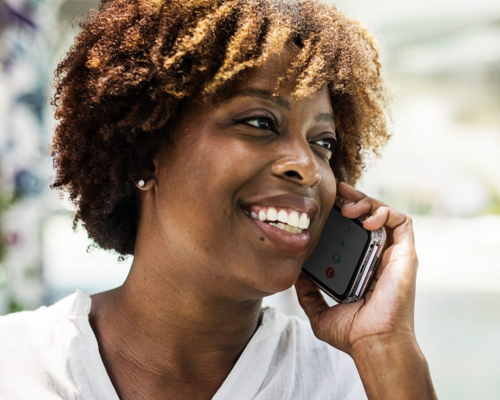 Happy woman talking on the phone